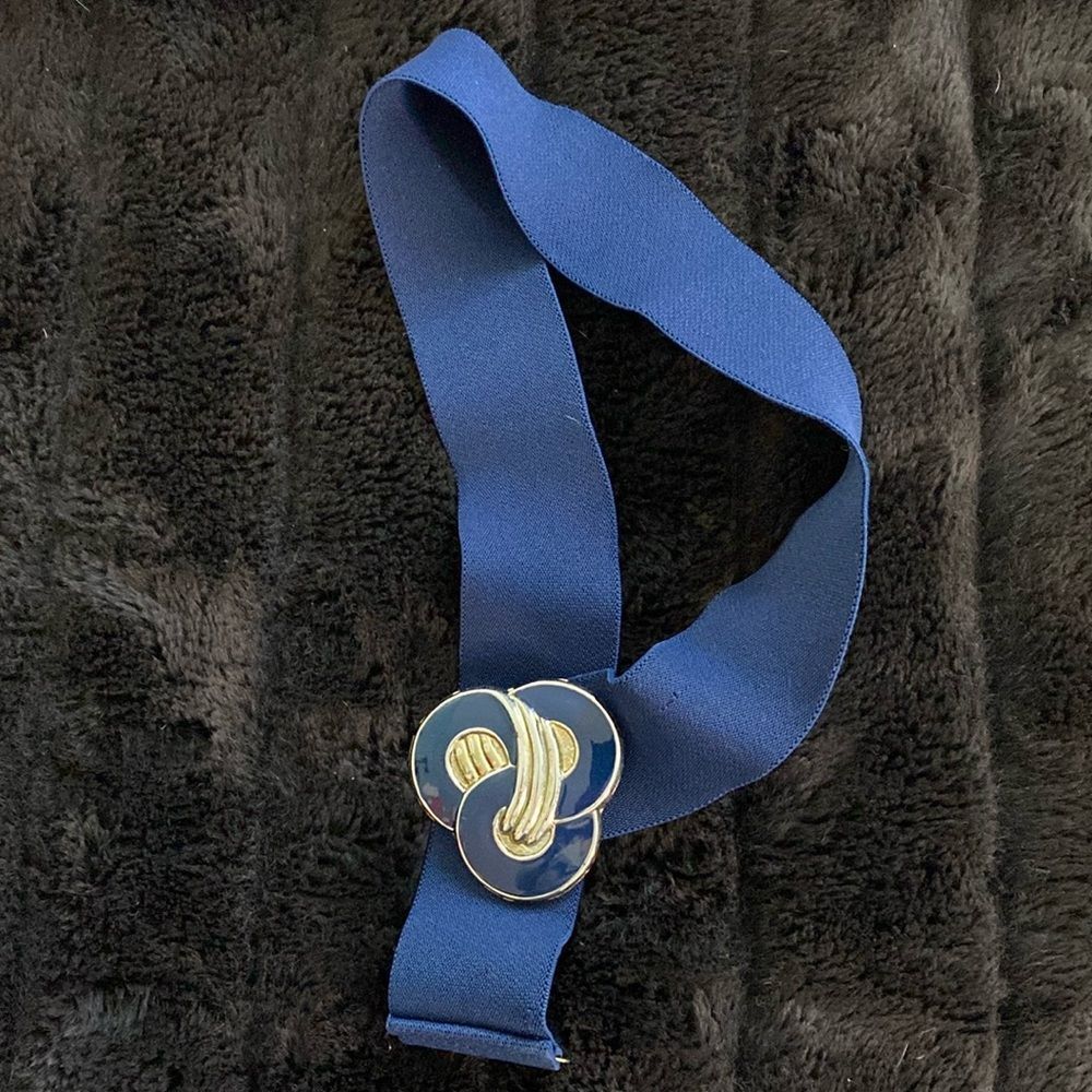 Vintage navy stretch belt with enamel buckle.